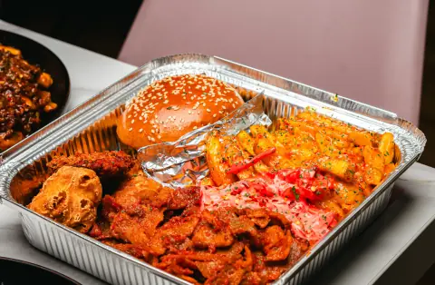 A Mr Brunch Munch Box with loaded fries, nuggets and a smash burger